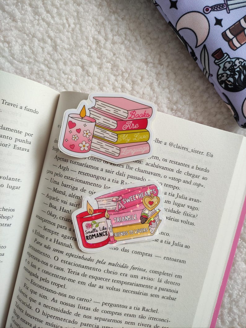 May include: A set of four pink and gold book-themed stickers with glitter accents. The stickers feature the text "Books Are My Love Language", "Sweethearts", "Triangle", and "Friends to Lovers". One sticker features a candle with hearts and flowers.