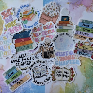 May include: A collection of colourful stickers featuring stacks of books with the text "Just One More Chapter" and "Just One More Page".