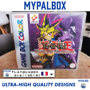 Peut inclure: Une cartouche de jeu Game Boy Color pour Yu-Gi-Oh! Duel des Ténèbres, avec un fond violet et une illustration de Yugi Muto et un magicien noir. Le jeu est en français.