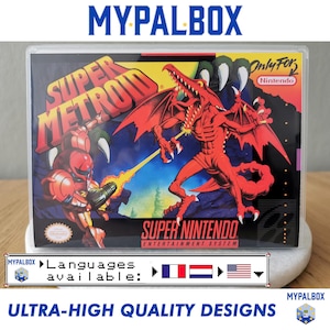 May include: A Super Nintendo game cartridge case featuring the game "Super Metroid." The case has a colorful illustration of characters from the game, with the text "Super Metroid" and "Super Nintendo Entertainment System." The case is labeled "Only For Nintendo."