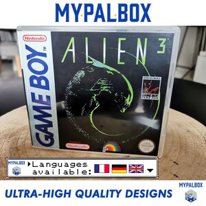 Pode incluir: Uma caixa de plástico transparente para um cartucho de jogo Game Boy. O jogo é Alien 3, e a caixa tem uma imagem preta e verde da criatura alienígena na frente. A caixa é etiquetada como "Original Game Boy Game Pak".