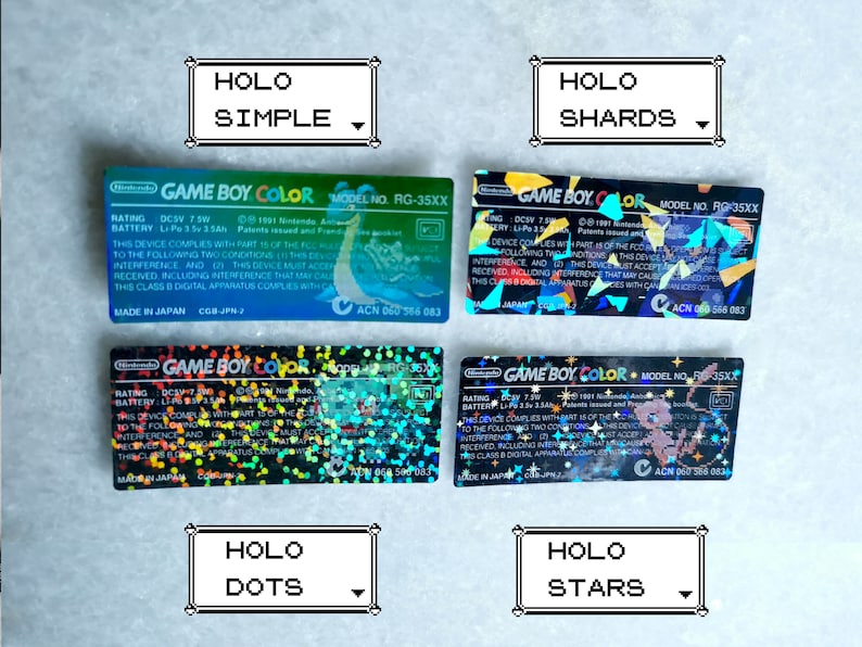May include: Four Game Boy Color cartridges with holographic labels. The labels feature different patterns: simple, shards, dots, and stars.