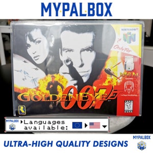 Peut inclure: Une cartouche de jeu vidéo pour la console Nintendo 64, mettant en scène le jeu GoldenEye 007. La cartouche est dans un boîtier en plastique transparent avec une image en noir et blanc de James Bond tenant une arme à feu. Le jeu est classé Teen par l'ESRB. Le texte "Only For" et "Rumble Pak Compatible" est visible sur la cartouche.