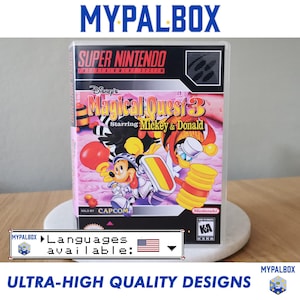 May include: A clear plastic case for a Super Nintendo game, featuring the game "Disney's Magical Quest 3 Starring Mickey & Donald." The case has the "MYPALBOX" logo and text "ULTRA-HIGH QUALITY DESIGNS" at the top and bottom.