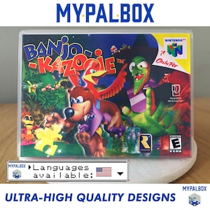 以下が含まれることがあります： Nintendo 64用ゲームソフトの透明プラスチックケース。パッケージには「バンジョーとカズーイの大冒険」のイラストが描かれており、茶色のクマ、赤い鳥、緑色の魔女が暗い背景に配置されています。ケースにはNintendo 64のロゴが含まれています。