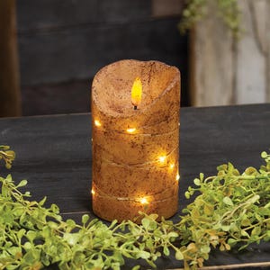 May include: A cylindrical LED pillar candle with a textured, speckled tan finish. The candle features a faux flame at the top and is wrapped in a thin wire string of small, glowing warm white LED lights that spiral around the exterior surface.