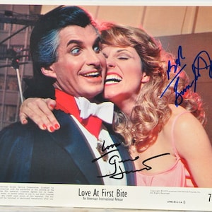 LOVE At FIRST BITE Cast Signed Photo X2 - George Hamilton & Susan St. James w/Coa