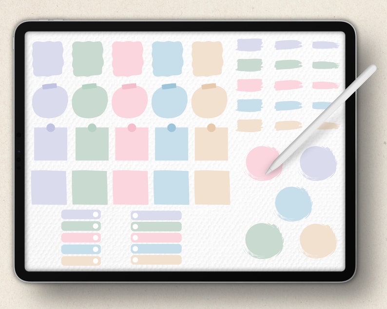 May include: A digital tablet screen displaying a variety of colorful shapes and lines. The shapes include circles, squares, rectangles, and rounded rectangles. The lines are in various shades of green, blue, pink, and beige. The shapes and lines are arranged in a grid pattern on the screen. A white stylus is lying on the screen.