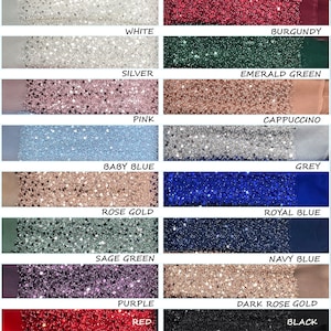 Op de afbeelding: Een kleurstaalkaart met 14 verschillende kleuren stof met een glinsterende textuur. De kleuren zijn wit, zilver, roze, babyblauw, roosgoud, saliegroen, paars, rood, bordeauxrood, smaragdgroen, cappuccino, grijs, koningsblauw, marineblauw, donkerroosgoud en zwart.