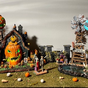 May include: A Halloween village scene featuring a spooky house, a windmill, a pond, and a sign that reads "Danger! Beware of Falling Pumpkins".