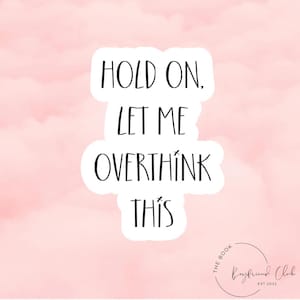 May include: A pink background with a white sticker that says "Hold on, let me overthink this". The sticker is from The Boyfriend Club, established in 2022.