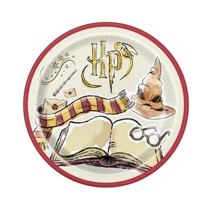 May include: Round paper plate with a red border. The plate features illustrations of a scarf, book, glasses, wand, envelope, and the letters "HP" with a lightning bolt. The background is cream-coloured.