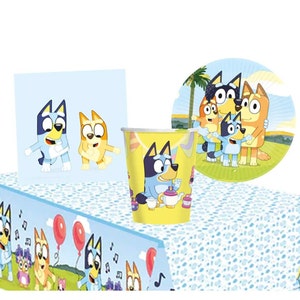 May include: Blue and yellow cartoon dog themed party supplies. The set includes a table cover, paper plates, cups, and napkins. The table cover features a blue and yellow cartoon dog with musical notes. The paper plates feature a blue and yellow cartoon dog with a palm tree in the background. The cups feature a blue and yellow cartoon dog with a teapot and teacups. The napkins feature a blue and yellow cartoon dog with musical notes.