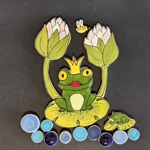 May include: A set of three ceramic mugs with a speckled, matte finish. The mugs are in shades of cream, light gray, and dark gray. Each mug has a simple, modern design and a rounded handle. Perfect for coffee or tea.