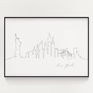 Puede incluir: Un dibujo en blanco y negro de la línea del horizonte de la ciudad de Nueva York, que incluye la Estatua de la Libertad y el puente de Brooklyn. El dibujo está enmarcado en un marco negro y el texto "Nueva York" está escrito debajo del horizonte.