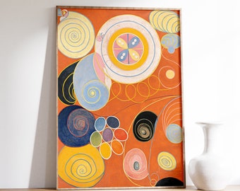 Puede incluir: Impresión de arte abstracto con una composición colorida de círculos, espirales y líneas sobre un fondo naranja. La impresión está enmarcada en un marco de madera simple.