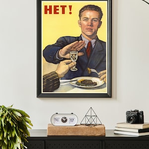 May include: A vintage Soviet propaganda poster with a man in a suit saying "HET!" while refusing a glass of alcohol and a plate of food.