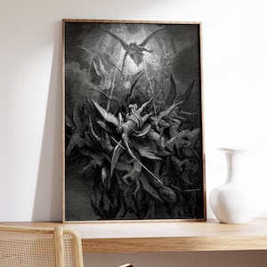 May include: A black and white illustration of a scene from the Bible, depicting the fall of Lucifer. The image shows a group of angels falling from the sky, with Lucifer at the centre. The image is framed in a wooden frame.