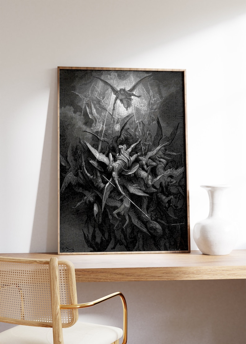 May include: A black and white illustration of a scene from the Bible, depicting the fall of Lucifer. The image shows a group of angels falling from the sky, with Lucifer at the centre. The image is framed in a wooden frame.