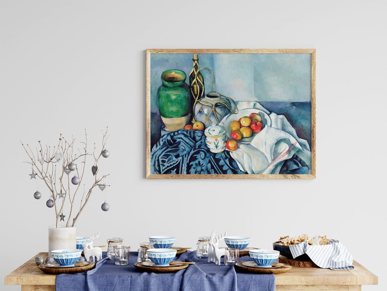 May include: A still life painting of a green vase, a white pitcher, a bowl of apples, and a white cloth on a blue patterned tablecloth.