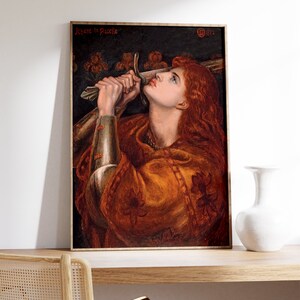 May include: A painting of a woman in armor holding a sword, looking up with a determined expression. The painting is titled "Jeanne la Pucelle" and dated 1882.