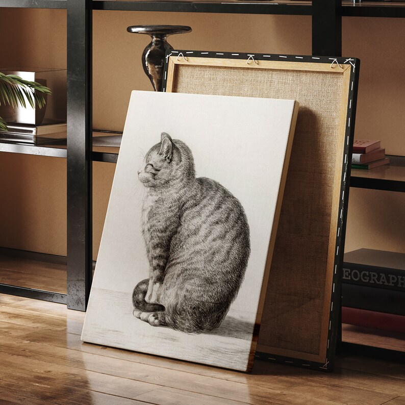 May include: A black and white drawing of a cat sitting on a white canvas. The cat is looking to the left and has a striped pattern.