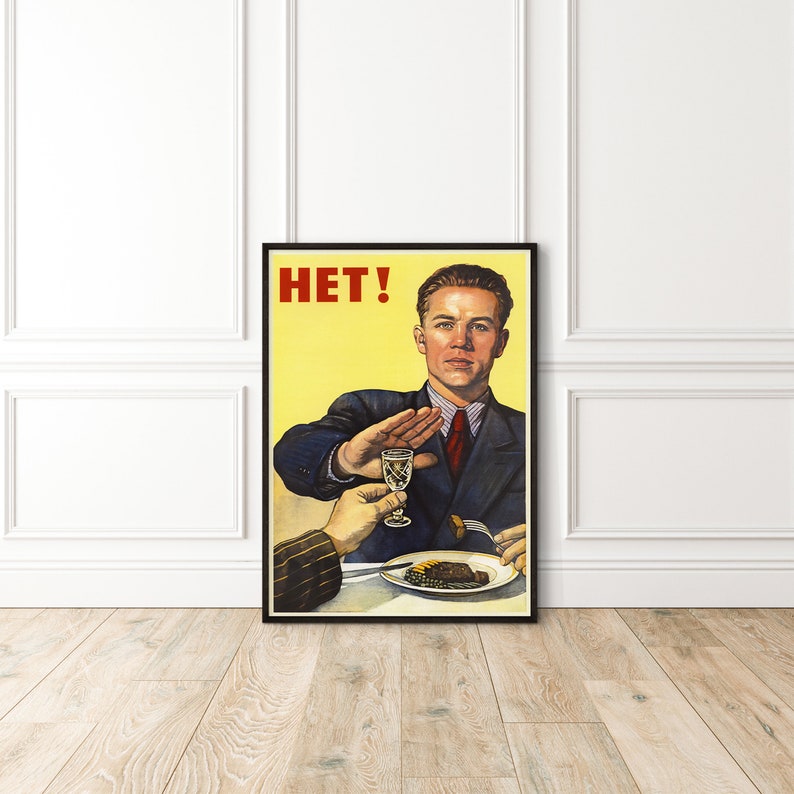 May include: A vintage propaganda poster with a man in a suit saying "HET!" with his hand raised in a stop gesture. He is refusing a glass of alcohol and a plate of food.
