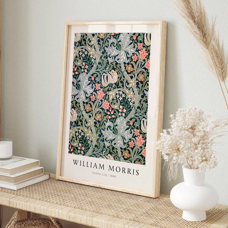 May include: A framed print of a vintage floral pattern in shades of green, blue, pink, and yellow. The print is titled "William Morris Golden Lily 1880".