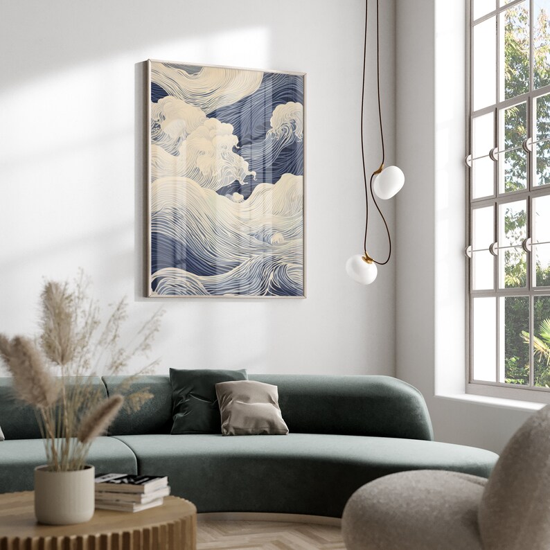 May include: A framed abstract print of blue and white waves. The print is in a modern style and would look great in a living room or bedroom.