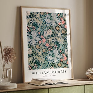 May include: A framed print of a vintage floral pattern in shades of green, pink, and blue. The print is titled "William Morris Golden Lily | 1880".