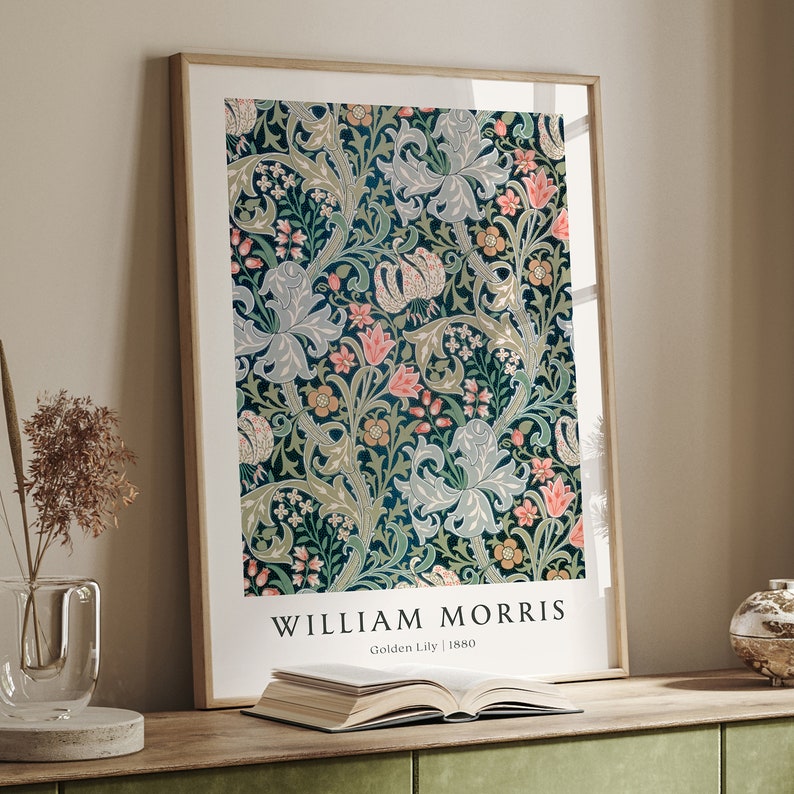 May include: A framed print of a vintage floral pattern in shades of green, pink, and blue. The print is titled "William Morris Golden Lily | 1880".