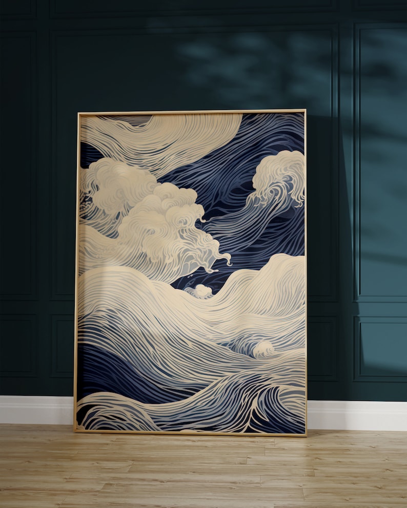 May include: A framed abstract art print with a blue and cream color scheme. The print features a stylized design of waves and clouds.