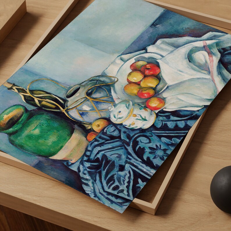 May include: A still life painting featuring a green ceramic pitcher, a blue and white ceramic jar, a white cloth, and a bowl of red apples on a blue and white patterned tablecloth.