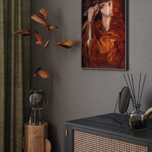 May include: A framed painting of a woman in a red dress holding a sword, with the title "Ave it Pute" above the image.