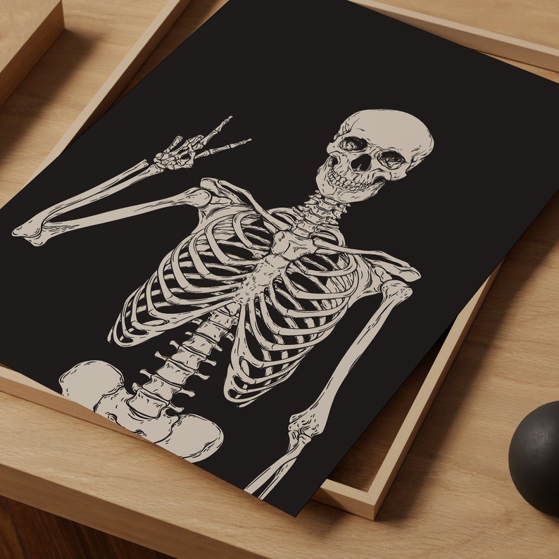 May include: A black and white illustration of a skeleton giving the peace sign. The skeleton is drawn in a detailed anatomical style.