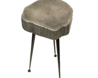 May include: A small, round, gray wooden side table with three black metal legs.