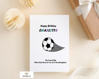 May include: A white card with a black and white soccer ball graphic and the text "Happy Birthday CHARLOTTE We Scored Big When God Gave Us You As A Grandaughter!"