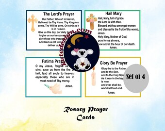 May include: Set of four colorful prayer cards with illustrations. The Lord's Prayer, Hail Mary, Fatima Prayer, and Glory Be Prayer are included. Each card has a different illustration: a cross, a flower, a dove, and a candle.