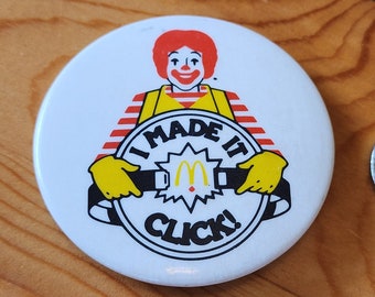 マクドナルドのヴィンテージボタンバッジ、しかめっ面バッジ