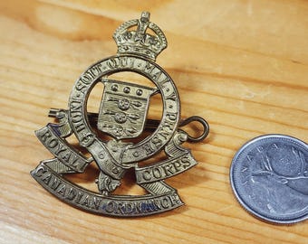 Honi Soit Qui Mal Y Pense - Royal Canadian Ordnance Corps Cap Badge