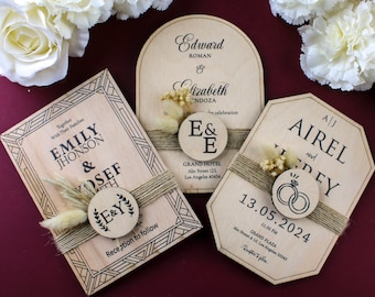 May include: Three wooden wedding invitations with rustic details. The invitations feature a couple's names, wedding date, and venue. Each invitation is decorated with dried flowers and a small wooden circle with a design.