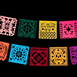 May include: A set of ten colorful paper banners with a Day of the Dead theme. The banners feature various designs, including skulls, flowers, and the text "Dia de Muertos".