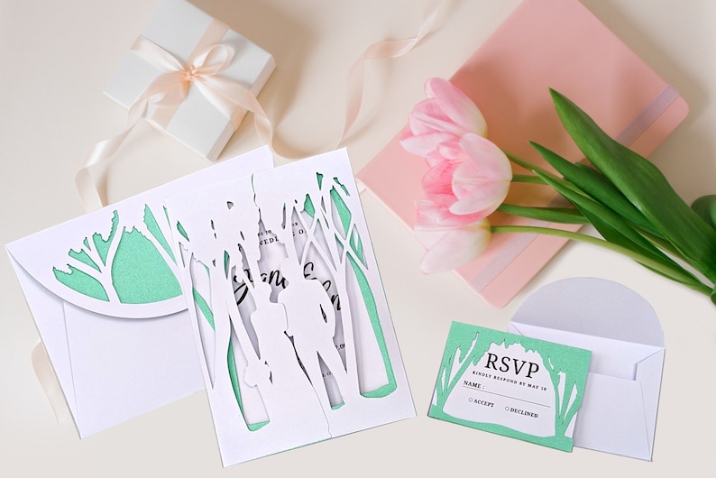 This beautiful hand-made card depicts a wedding bride and groom in an enchanted forest surrounded by a cathedral of trees.