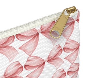 Pochette rose pour accessoires avec noeud