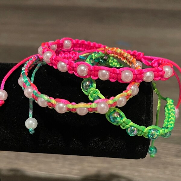 Delicate bracelet with 10 beads between braided knots. Colors to choose.Nice gift for a friend, mother, for yourself to complement any style