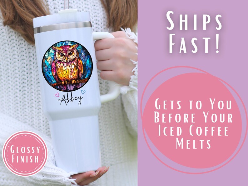 May include: White insulated tumbler with a large handle, featuring a colorful owl design in a stained-glass style. The tumbler has the name "Abbey" and two small hearts. The text "Glossy Finish" is in a pink circle.
