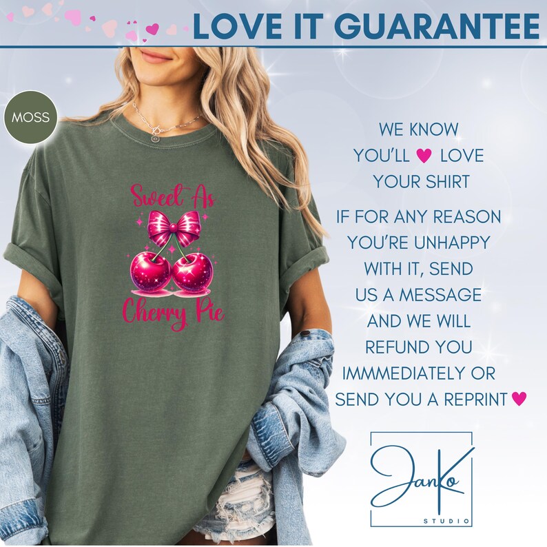 May include: A green t-shirt with the text "Sweet As Cherry Pie" in pink lettering. The text is accompanied by a graphic of two cherries with a pink bow on top. The shirt is being modeled by a person. The text "LOVE IT GUARANTEE" is at the top of the image. The text "WE KNOW YOU'LL LOVE YOUR SHIRT" is on the right side of the image. The text "IF FOR ANY REASON YOU'RE UNHAPPY WITH IT, SEND US A MESSAGE AND WE WILL REFUND YOU IMMEDIATELY OR SEND YOU A REPRINT" is on the right side of the image. The text "Janko STUDIO" is at the bottom of the image.
