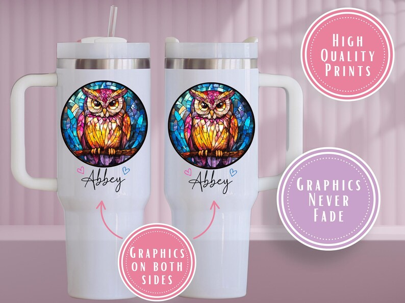 May include: White travel mug featuring a colorful owl design in a stained-glass style. The owl is perched on a branch within a circular frame. The name "Abbey" is written below the owl. The mug has a handle and a straw.