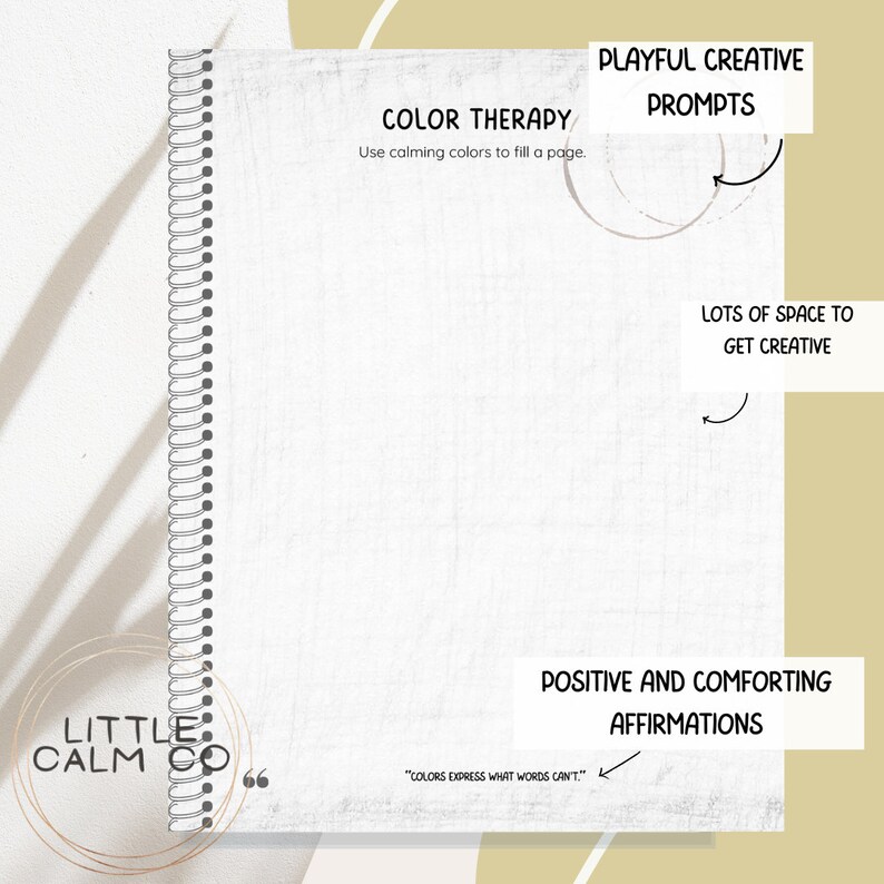 May include: A spiral-bound notebook with the text "COLOR THERAPY" and "Use calming colors to fill a page." The notebook also features "PLAYFUL CREATIVE PROMPTS," "LOTS OF SPACE TO GET CREATIVE," and "POSITIVE AND COMFORTING AFFIRMATIONS."