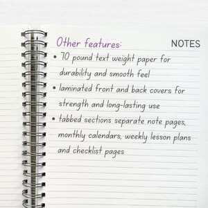May include: A close-up of a notebook with a spiral binding. The notebook has lined pages and the text "Other features:" and "NOTES" is written on the page. The text lists features of the notebook, including 70 pound text weight paper, laminated covers, tabbed sections, monthly calendars, weekly lesson plans, and checklist pages.